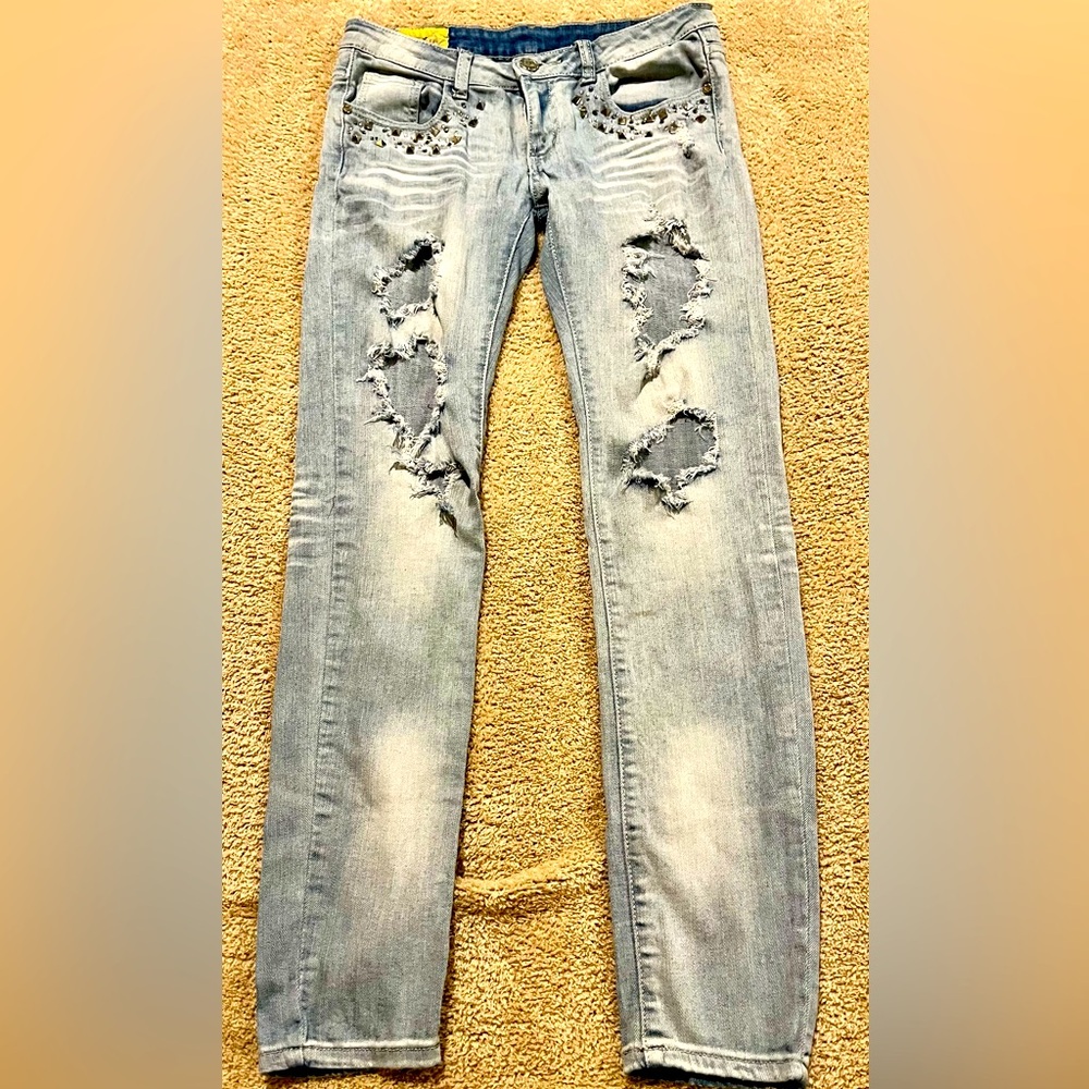Machine Distressed/Ripped Jeans